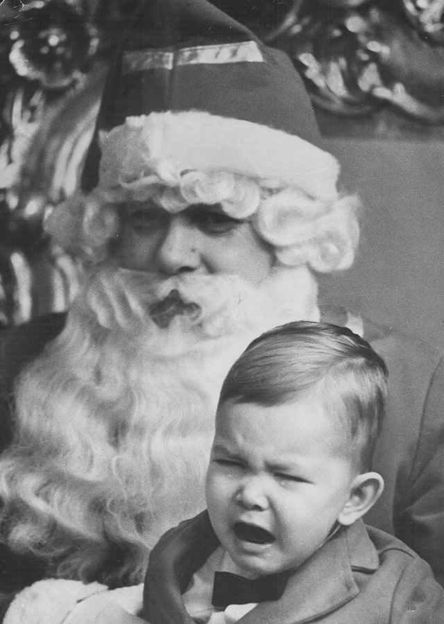 Children who’ll open their eyes wide at a distant view of lighted Christmas tree may hide them from